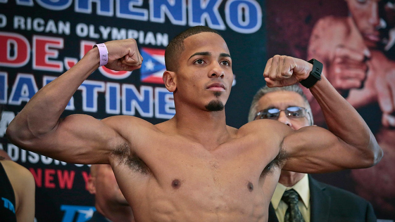 Boxer Felix Verdejo flexes his muscles before an NYC weigh in