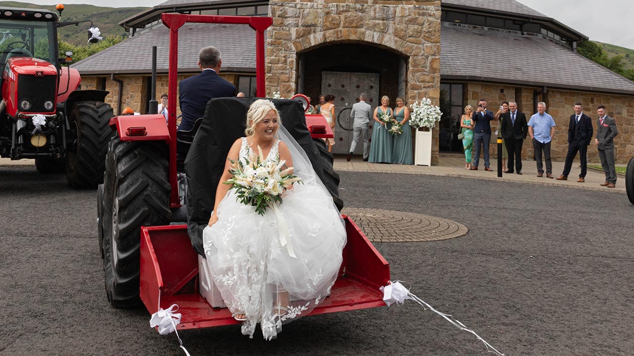 Bridal haul: Woman arrives for her wedding on the back of a tractor, 'laughed the whole way'