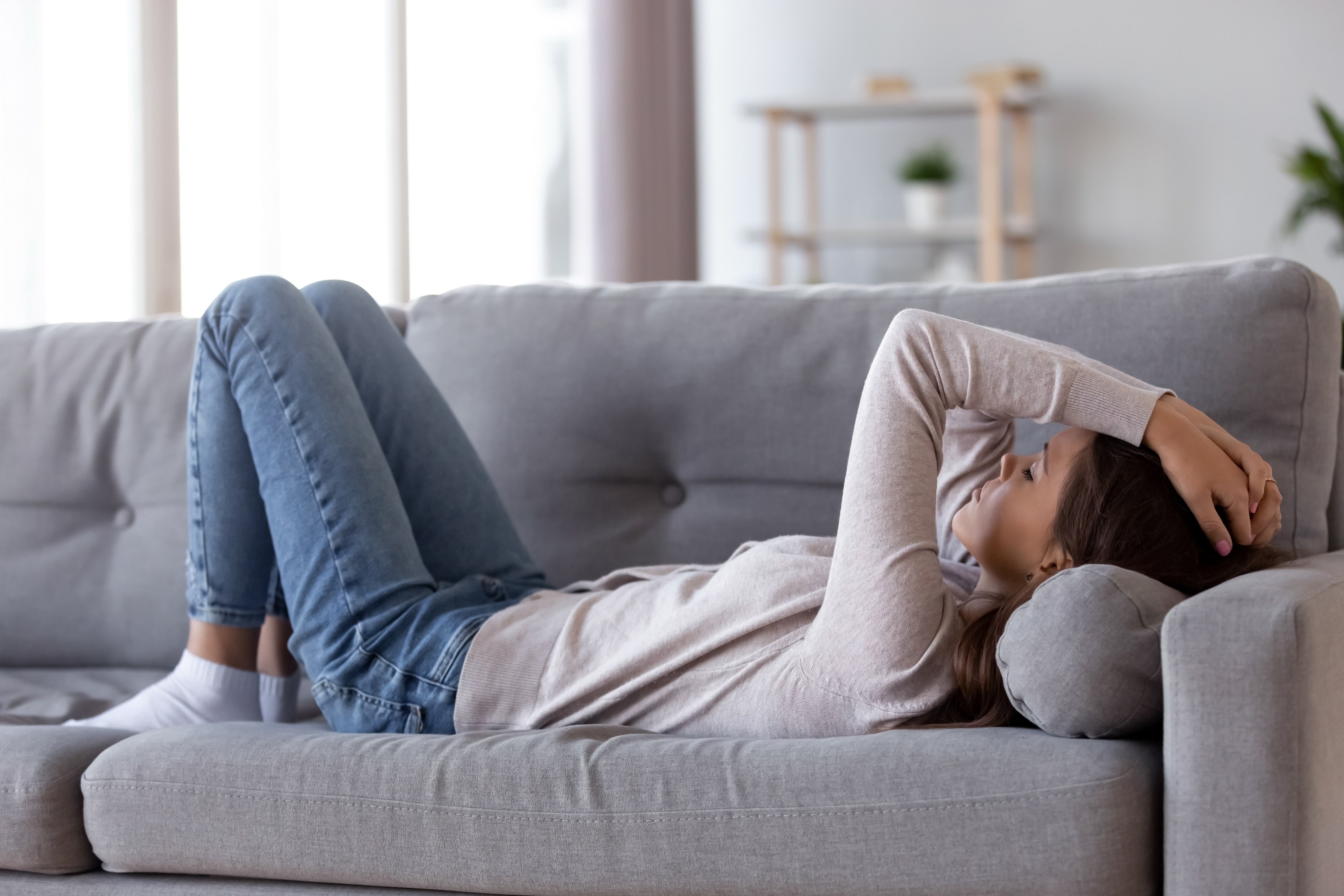 sad woman on couch