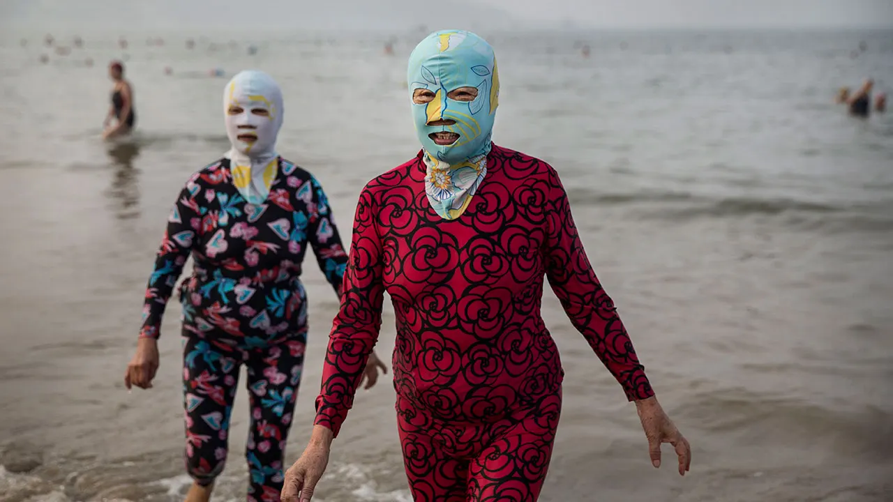 Bizarre 'facekinis' fashion craze hits China beaches amid record heat