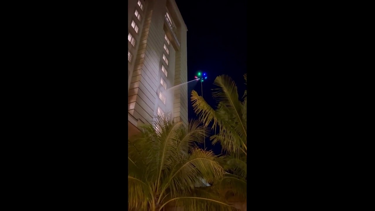 UFO-like drone seen cleaning windows outside hotel