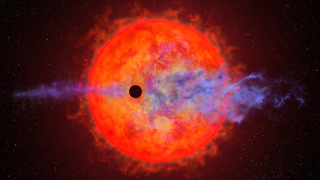 Hubble Space Telescope sees planet around red dwarf star getting hiccups