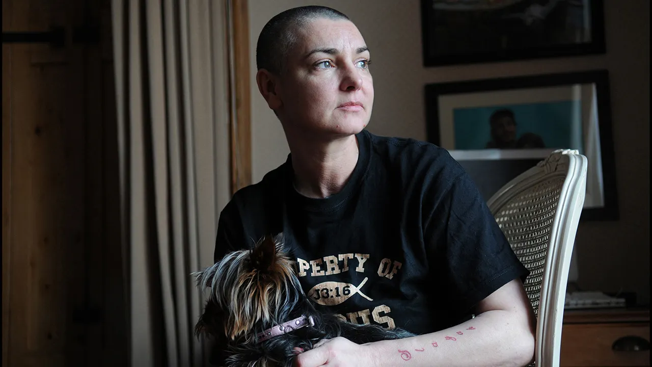 Sinead O'Connor posing for photos in her home