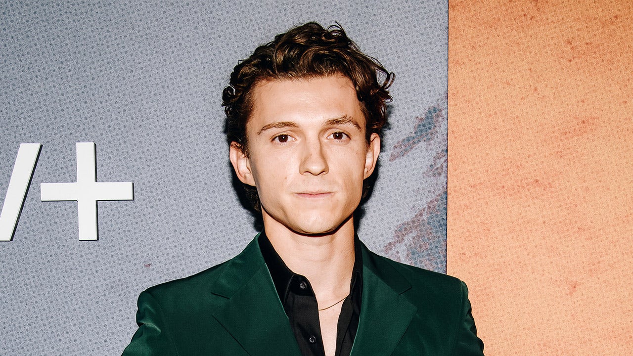 Tom Holland wears green velour suit on red carpet