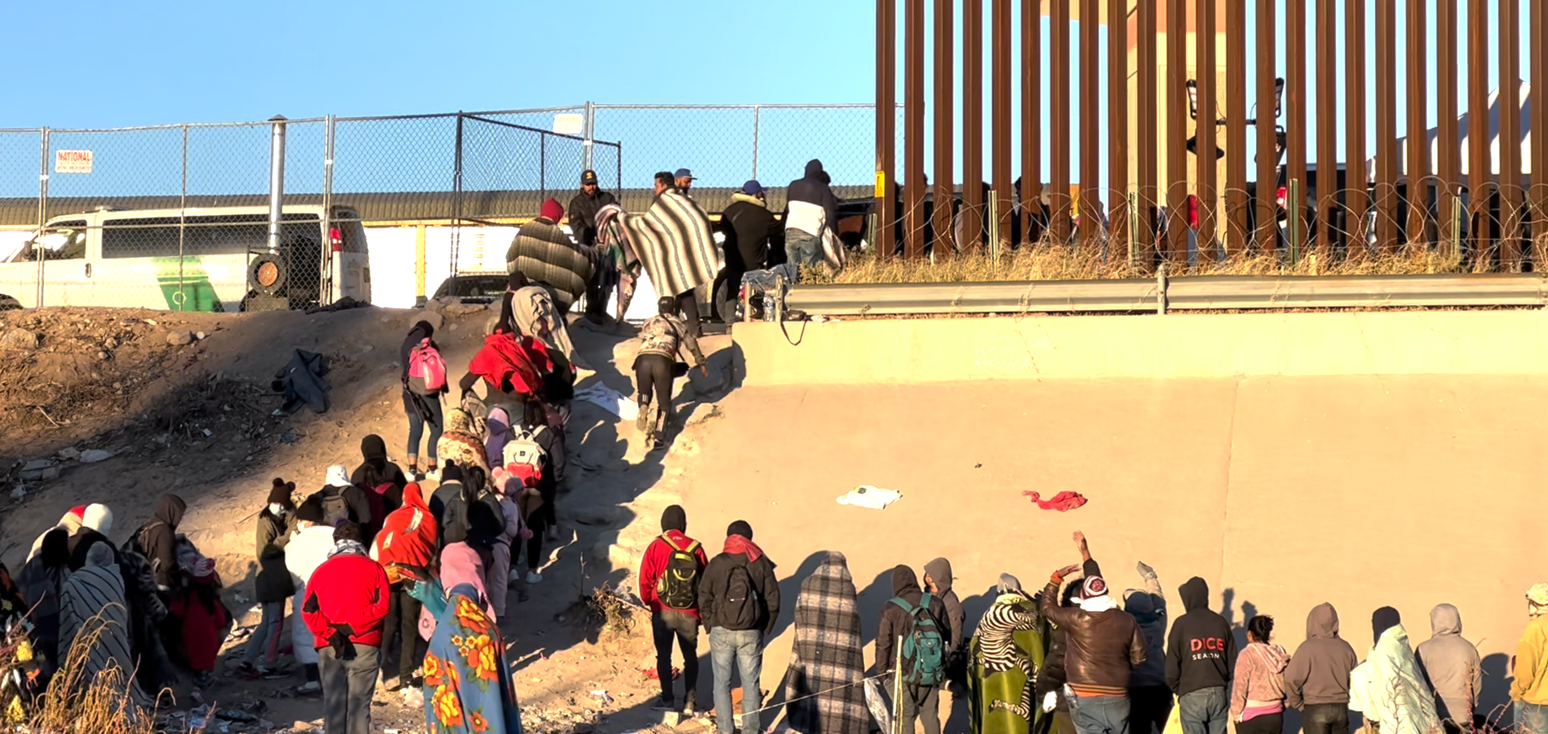 Migrants standing in line at the Border